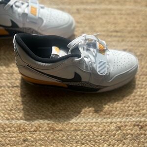 Air Jordan Legacy 312 Low in White, Black, and Yellow Ochre
